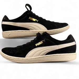 Puma Vikky, in a black and white colorway with gold logo detailing size 8.5